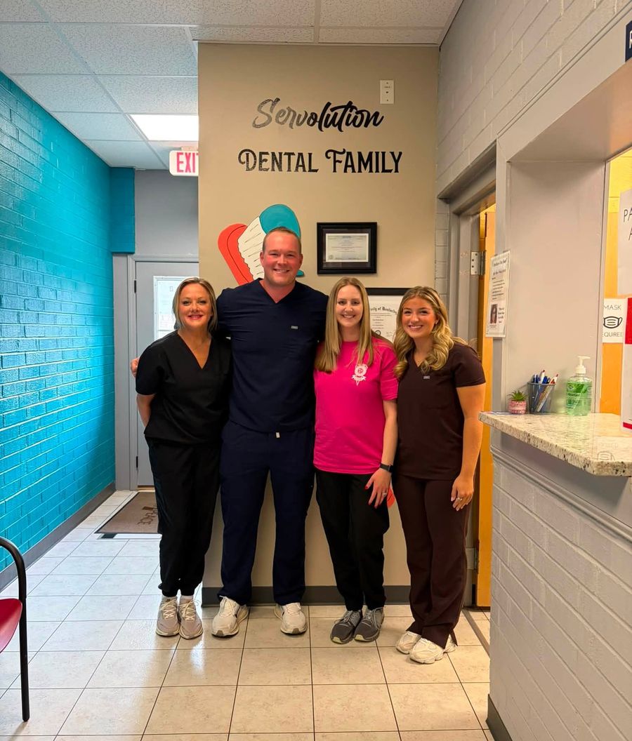 The Servolution dental team standing together at the clinic